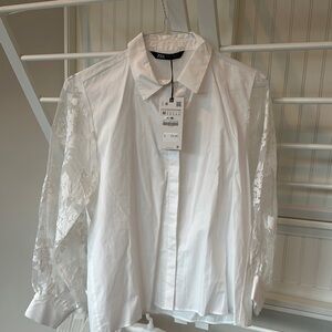 Zara women’s crisp White Shirt with lace Sleeves size Medium.